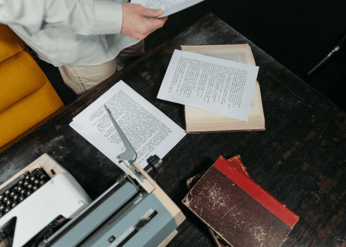 Author reviewing manuscript pages before Amazon Self Publishing and book formatting